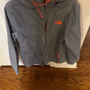 The North Face Orange and Gray Rain jacket.